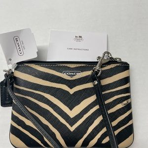 Coach Zebra Wristlet new with tags. Comes with gift box and tissue.